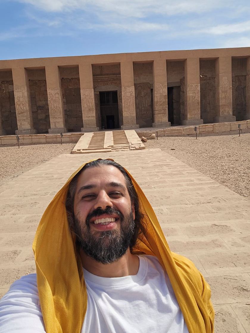 Ali Odeh, founder of The Lotus Priest, standing before the temple at Abydos in Egypt.